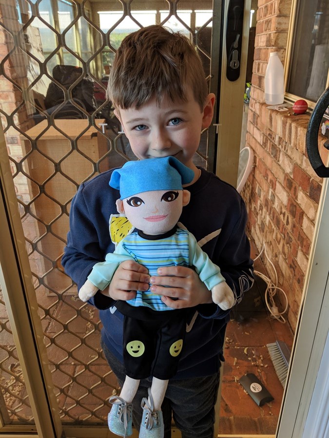 Tegan's son Joey with one of the dolls