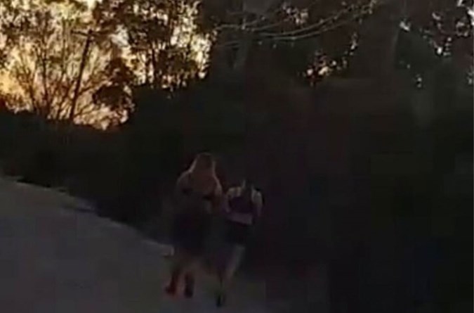 Shocking footage shows the bizarre moment the man confronted the girls, who claimed they had to burn their clothes on the side of the road. Image: Facebook