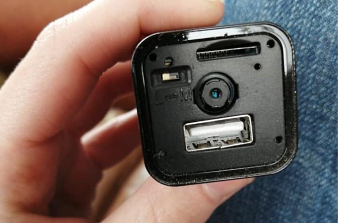 Natasha removed the front of the charger and found a small camera. Image: Facebook