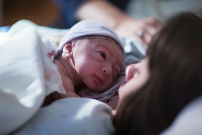 A newborn with mum in hospital.