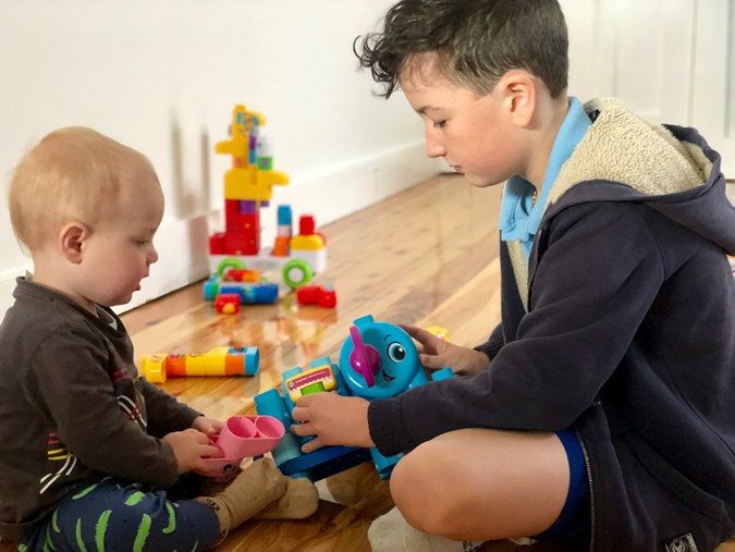 Louis watches his big brother, Maxwell, pop different double-sided blocks into the SmartStar Unit to ‘make the elephant talk’!